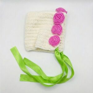 Adorable Crochet Bonnet with Pink Rosettes and Green Ribbons